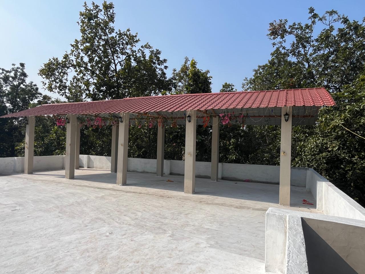 Luxury resort pool with palm trees at sunset